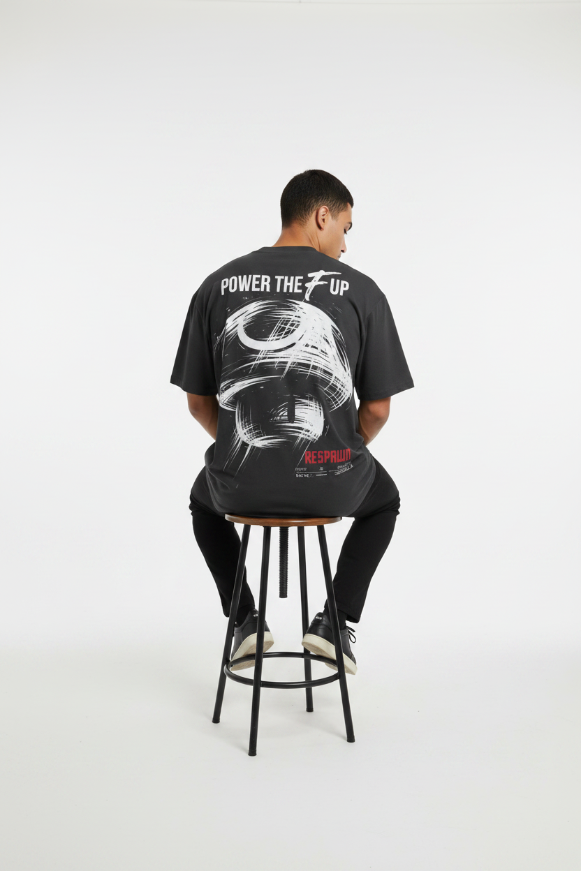 Male model, seated back pose, black tee