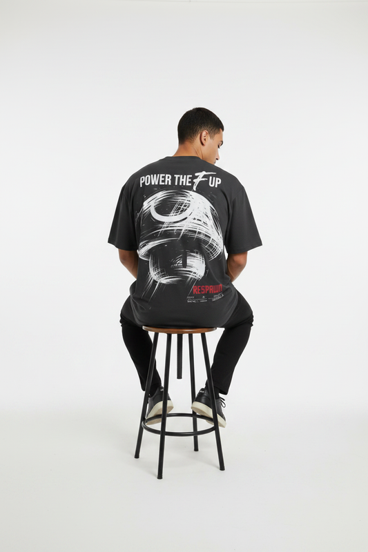 Male model, seated back pose, black tee