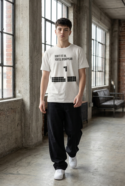 Male teen walking in Flower Gray tee, wide black pants and white sneakers